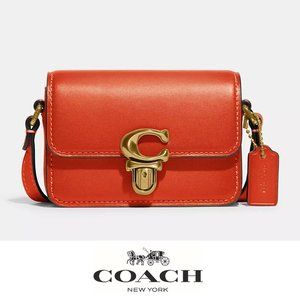 Coach orange Crossbody Bag with Gold Accents